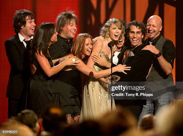 Taylor Swift along with her backup band onstage at the 43rd Annual CMA Awards at the Sommet Center on November 11, 2009 in Nashville, Tennessee.