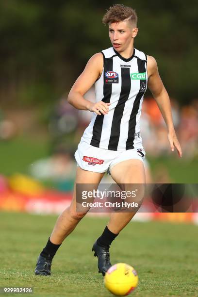 Emma Grant of the Magpies runs for the ball during the round six AFLW match between the Brisbane Lions and the Collingwood Magpies at Moreton Bay...