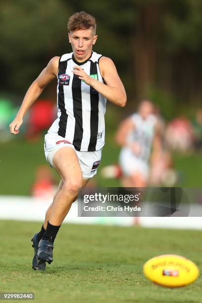 Emma Grant of the Magpies runs for the ball during the round six AFLW match between the Brisbane Lions and the Collingwood Magpies at Moreton Bay...