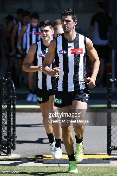 Scott Pendlebury of the Magpies leads the team out during the JLT Community Series AFL match between Collingwood Magpies and the Western Bulldogs at...