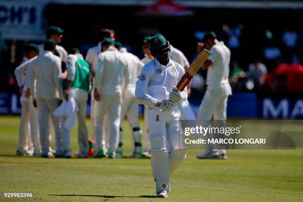 South Africa's batsman Kagiso Rabada leaves the ground after having been dismissed by Australia's bowler Pat Cummins during day two of the second...