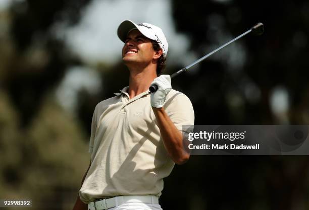 Adam Scott of Australia plays an approach shot on the 8th hole during round one of the 2009 Australian Masters at Kingston Heath Golf Club on...