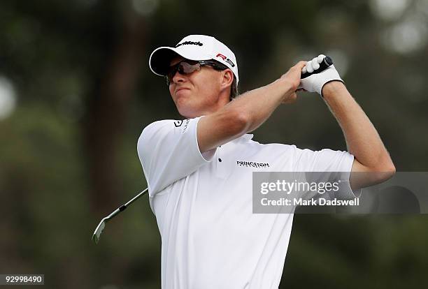 John Senden of Australia plays an approach shot on the 7th hole during round one of the 2009 Australian Masters at Kingston Heath Golf Club on...