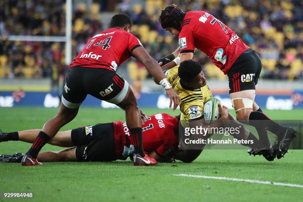 Julian Savea of the Hurricanes is brought down during the round four Super Rugby match between the Hurricanes and the Crusaders at Westpac Stadium on...
