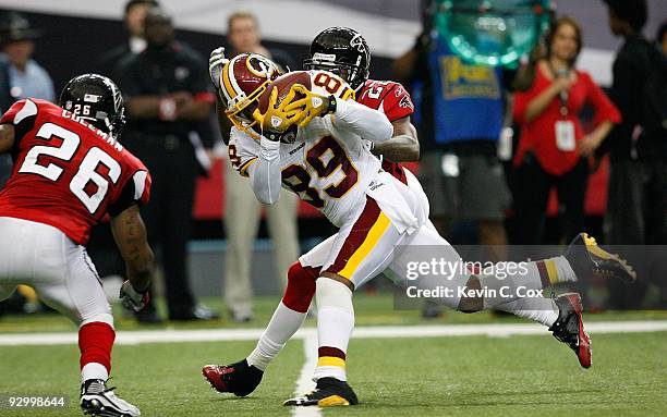 Chevis Jackson of the Atlanta Falcons defends as Erik Coleman breaks up a pass intended for Santana Moss of the Washington Redskins at Georgia Dome...