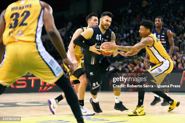 Brian Sacchetti C) of Germani competes with Diante Maurice Garrett and Aleksander Vujacic and Trevor Mbakwe of Fiat during the match final of Coppa...