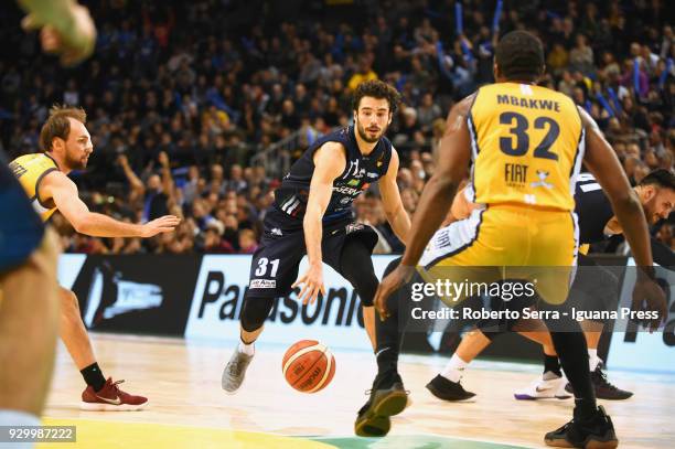 Michele Vitali of Germani competes with Giuseppe Poeta and Trevor Mbakwe of Fiat during the match final of Coppa Italia between Auxilium Fiat Torino...