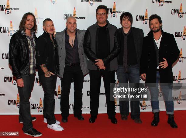 Musician Chris Daughtry with Daughtry and Vince Gill attends the 43rd Annual CMA Awards at the Sommet Center on November 11, 2009 in Nashville,...