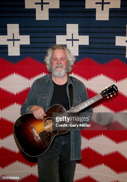 Robert Earl Keen poses with his 1935 Gibson acoustic guitar at the Texas Monthly party during the South By Southwest Conference and Festivals at the...