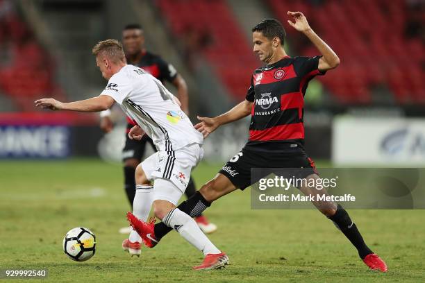 Goran Paracki of The Phoenix takes on Marcelo Carrusca of the Wanderers during the round 22 A-League match between the Western Sydney Wanderers and...