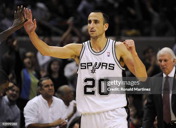 Manu Ginobili of the San Antonio Spurs celebreates after shooting a three-pointer in the closing minutes of the second quarter against the Dallas...