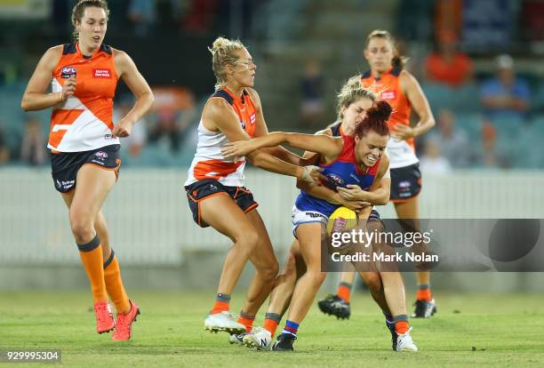 Jenna Bruton of the Bulldogs is tackled during the round six AFLW match between the Greater Western Sydney Giants and the Western Bulldogs at UNSW...