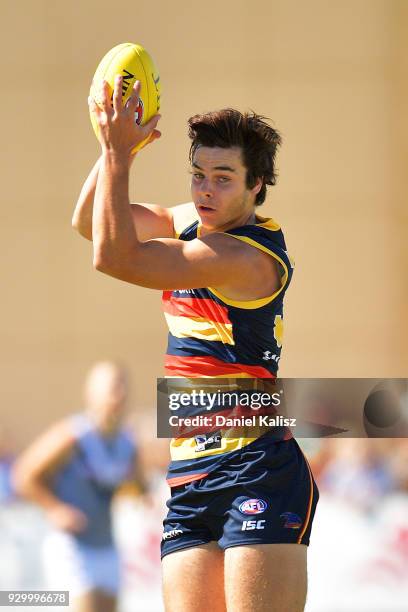 Darcy Fogarty of the Crows marks the ball during the JLT Community Series AFL match between Port Adelaide Power and the Adelaide Crows at Alberton...