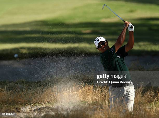 Michael Campbell of New Zealand plays out of a bunker on the 17th hole during round one of the 2009 Australian Masters at Kingston Heath Golf Club on...