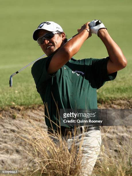 Michael Campbell of New Zealand plays out of a bunker on the 17th hole during round one of the 2009 Australian Masters at Kingston Heath Golf Club on...