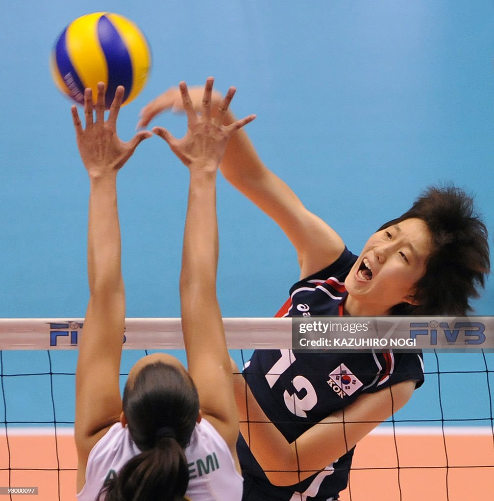 South Korea's Park Jeong-Ah (R) spikes t