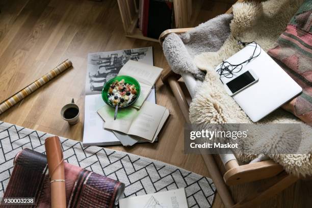 high angle view of food and drink with books on floor in home office - sheepskin stock pictures, royalty-free photos & images