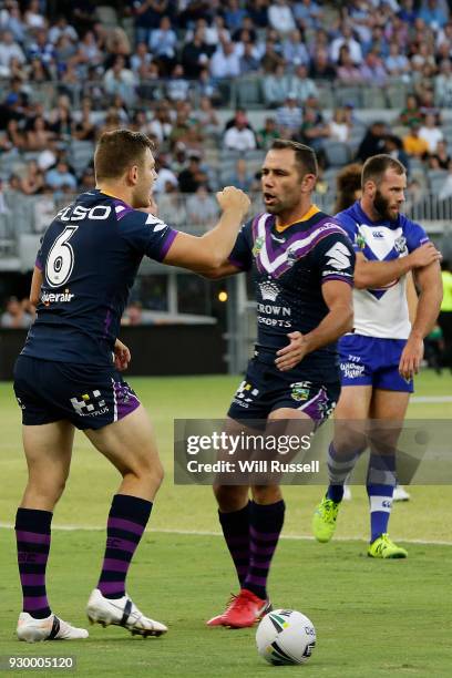 Ryley Jacks of the Storm celebrates after scoring a try during the round one NRL match between the Canterbury Bulldogs and the Melbourne Storm at...