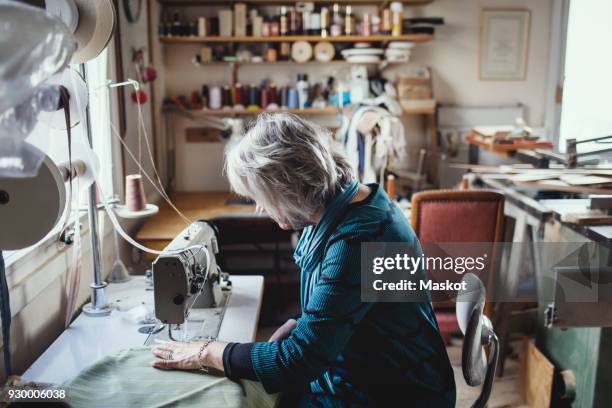 Using Traditional Sewing Machine 154 Old Sewing Machine Table Stock Photos, High-Res Pictures, and ...