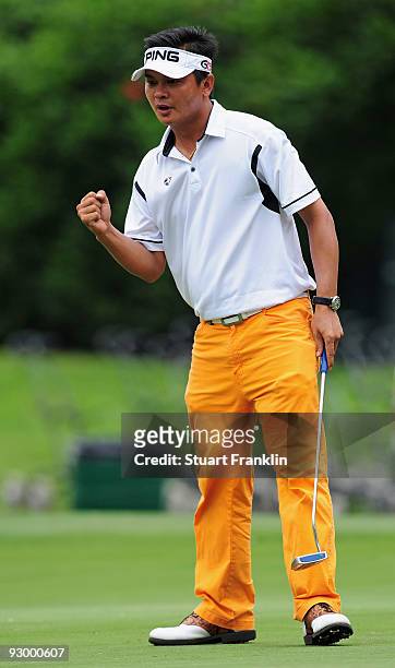 Wen- Tang Lin of of Taiwan celebrates huis putt on the nineth hole during the first round of the UBS Hong Kong Open at the Hong Kong Golf Club on...