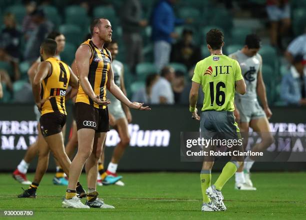 Jarryd Roughead of the Hawks has words with the umpire after the final siren, during the JLT Community Series AFL match between the Hawthorn Hawks...