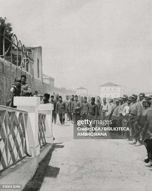 The first group of Turkish prisoners arriving in Rhodes, Greece, Italian-Turkish war, photograph by A Vetta, from L'Illustrazione Italiana, Year...