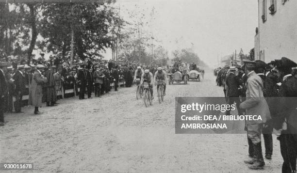 Carlo Galetti crossing the finish line in Florence, first stage of the Tour of Italy cycling race, from L'Illustrazione Italiana, Year XXXVIII, No...