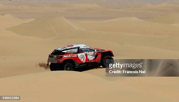 Sheikh Khalid Al Qassimi of UAE and Xavier Panseri of France and Peugeot 3008 DKR race during day two of the Dubai International Baja on March 10,...
