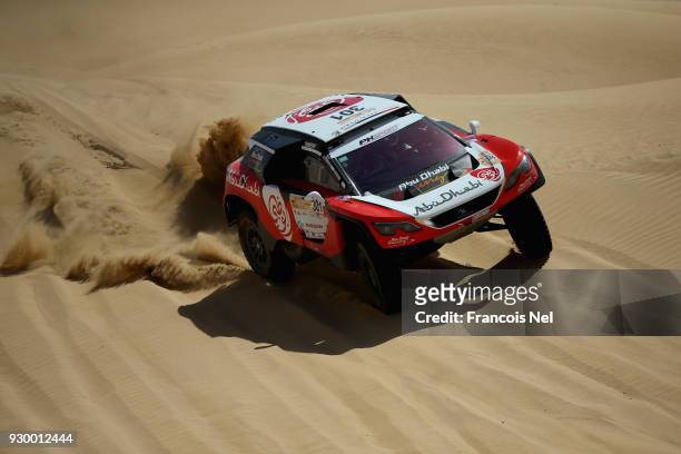 Sheikh Khalid Al Qassimi of UAE and Xavier Panseri of France and Peugeot 3008 DKR race during day two of the Dubai International Baja on March 10,...