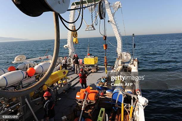 Michel SAILHAN French Research Institute for Exploitation of the Sea team prepares to put in water the robot BOB to observe and study the link...