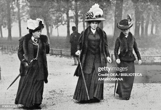 Queen of Spain Victoria Eugenie of Battenberg with her mother, Princess Beatrice of Battenberg , in Kensington Gardens in London, England, drawing by...