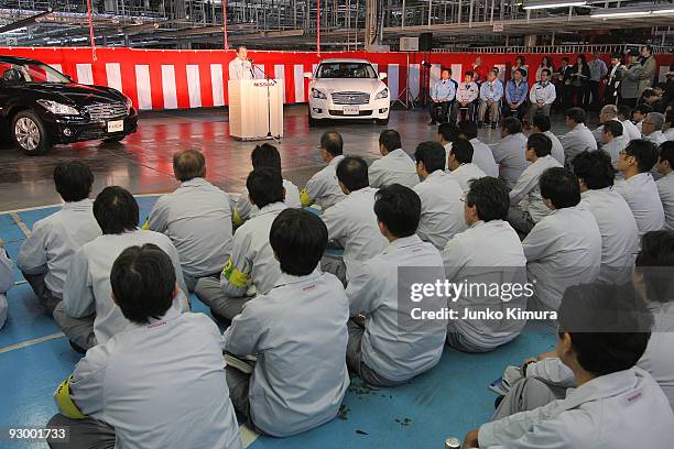 Nissan's Chief Operating Officer, Yoshiyuki Shiga speaks in front of plant workers during the off line ceremony for the latest FUGA motor car at the...
