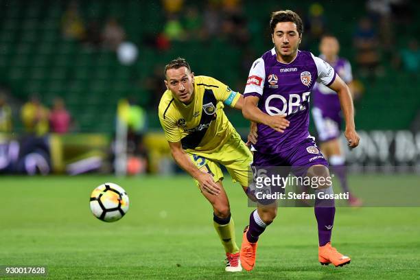 Alan Baro of the Mariners and Jacob Italiano of the Glory contest the ball during the round 22 A-League match between the Perth Glory and the Central...