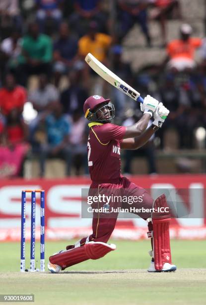 Rovman Powell of The West Indies hits out during The ICC Cricket World Cup Qualifier between The West Indies and Ireland at The Harare Sports Club on...