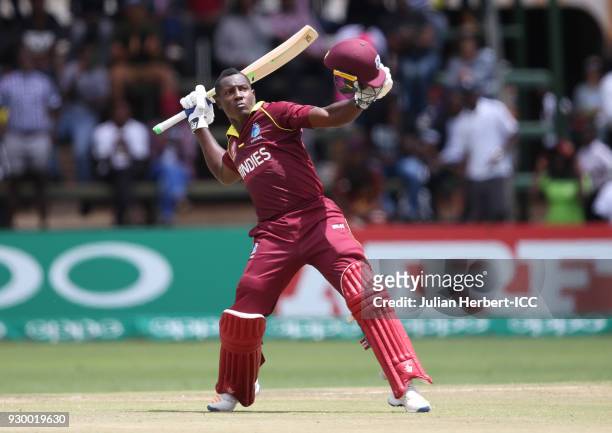 Rovman Powell of The West Indies celebrates his century during The ICC Cricket World Cup Qualifier between The West Indies and Ireland at The Harare...