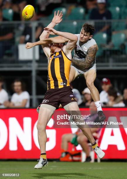 Jarryd Roughead of the Hawks and Aaron Mullett of the Blues compete for the ball during the AFL 2018 JLT Community Series match between the Hawthorn...