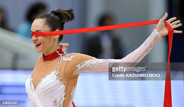 Anna Bessonova of Ukraine smiles as she finishes her performance during the ribbon apparatus final at the Rhythmic Gymnastics World Championships in...