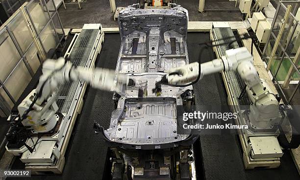 Arm robots assemble parts at Nissan's Tochigi Plant as Nissan announce the opening of the latest FUGA motor car production line on November 12, 2009...
