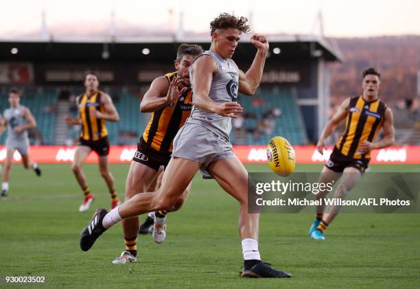 Charlie Curnow of the Blues is tackled by Ricky Henderson of the Hawks during the AFL 2018 JLT Community Series match between the Hawthorn Haws and...