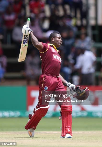 Rovman Powell of The West Indies celebrates his century during The ICC Cricket World Cup Qualifier between The West Indies and Ireland at The Harare...