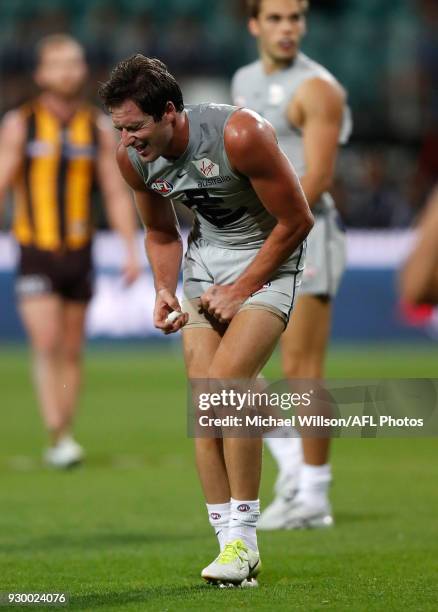 Jed Lamb of the Blues grimaces during the AFL 2018 JLT Community Series match between the Hawthorn Haws and the Carlton Blues at UTAS Stadium on...