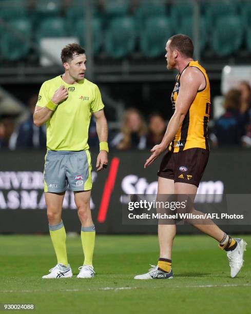 Umpire Brendan Hosking and Jarryd Roughead of the Hawks share a conversation after the final siren during the AFL 2018 JLT Community Series match...