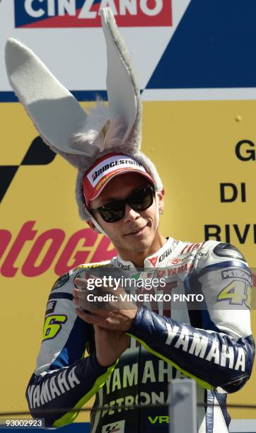 Italian Yamaha rider Valentino Rossi celebrates on the podium of the MotoGP race of the San Marino Grand Prix in Misano on September 6, 2009. Rossi...