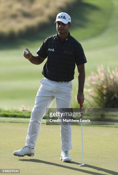 Shubhankar Sharma of India celebrates a putt on the 16th green during day three of the Hero Indian Open at Dlf Golf and Country Club on March 10,...