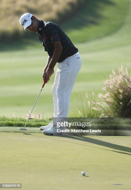 Shubhankar Sharma of India makes a putt on the 16th green during day three of the Hero Indian Open at Dlf Golf and Country Club on March 10, 2018 in...