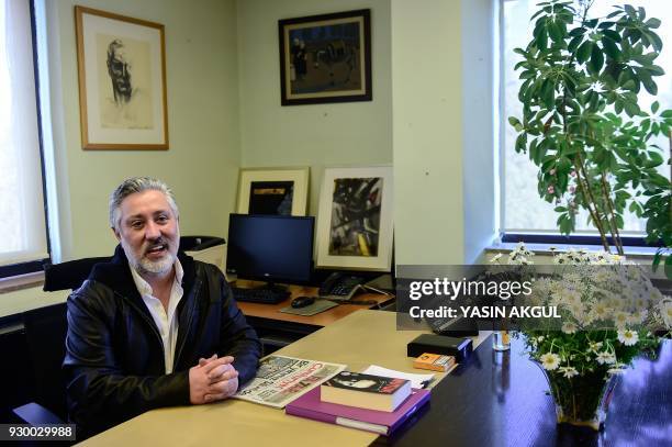 Freed journalist, editor-in-chief of Cumhuriyet Turkish daily newspaper, Murat Sabuncu is pictured at his desk on March 10, 2018 in Istanbul. Two...