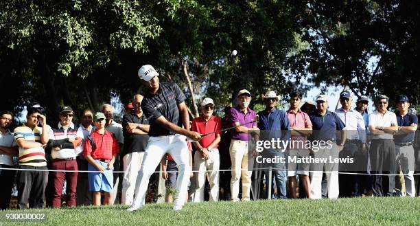 Shubhankar Sharma of India chips onto the 16th green during day three of the Hero Indian Open at Dlf Golf and Country Club on March 10, 2018 in New...