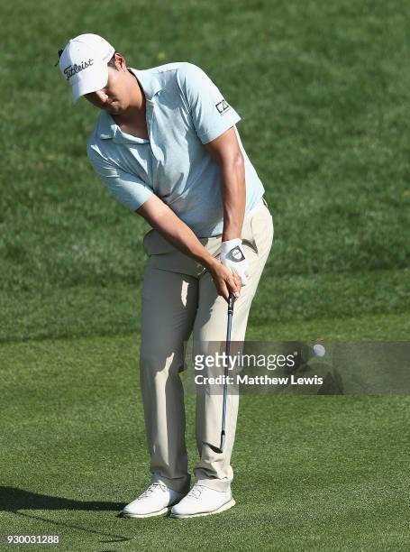 Sihwan Kim of the United States chips onto the 15th green during day three of the Hero Indian Open at Dlf Golf and Country Club on March 10, 2018 in...