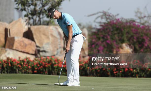 Matthias Schwab of Austria makes a putt on the 17th green during day three of the Hero Indian Open at Dlf Golf and Country Club on March 10, 2018 in...