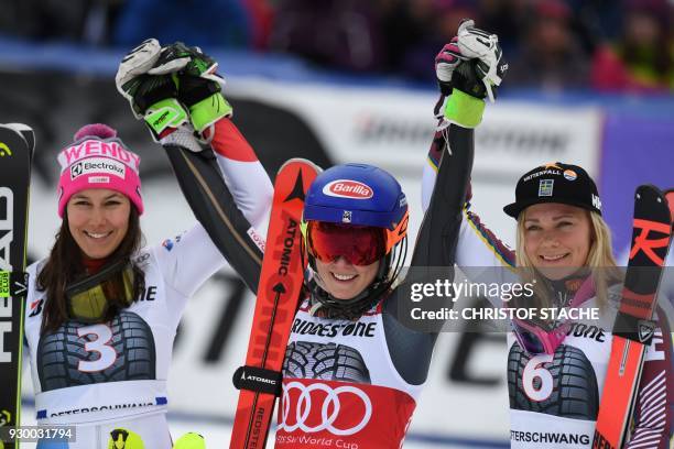 Second placed, Switzerland's Wendy Holdener, winner US Mikaela Shiffrin and Sweden's Frida Hansdotter celebrate after the FIS World Cup Women's...